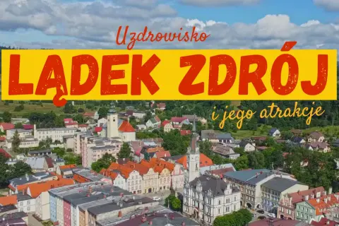 Uzdrowisko Lądek-Zdrój i jego atrakcje. Widok z lotu ptaka na urokliwe miasteczko z kolorowymi kamienicami i zielonymi wzgórzami w tle.